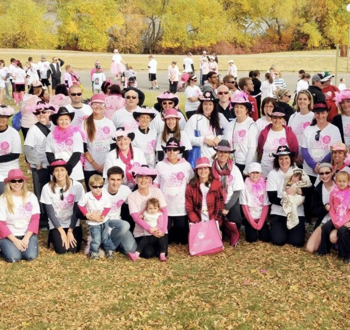 A large group in pink at a fundraising walk