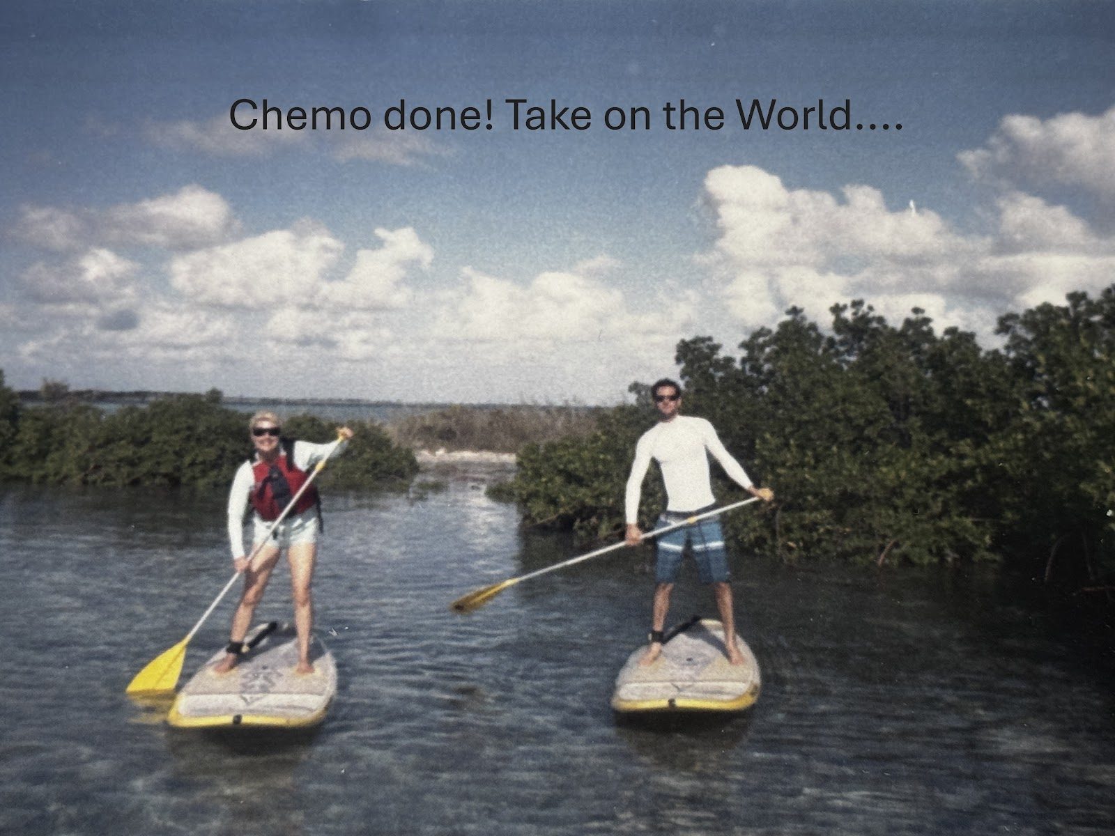 Laura and Chad paddleboarding after chemo, with the words ‘Chemo done! Take on the world’